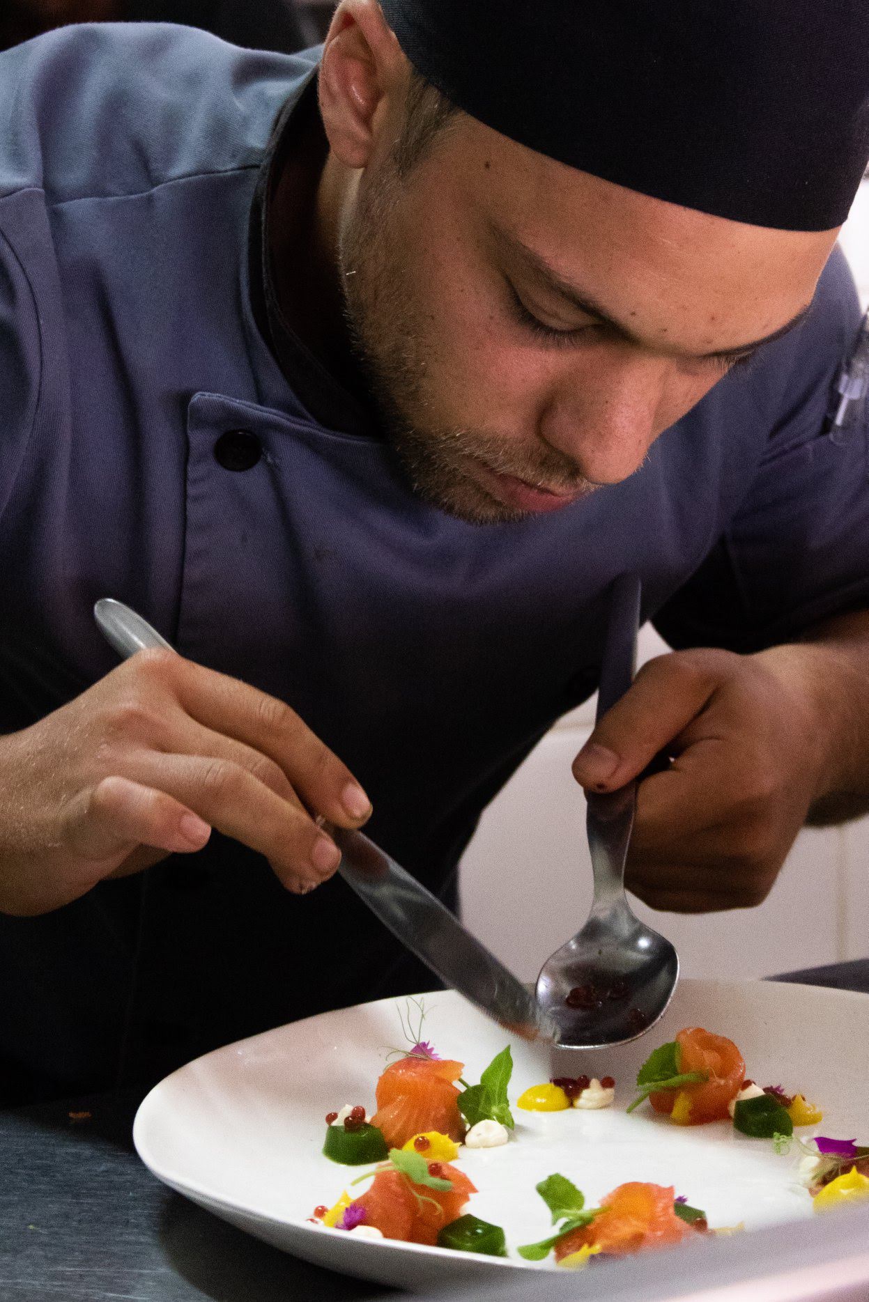 Stewart putting the finishing touches to a dish